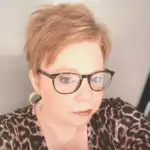 Paulette, life coach for midlife women, smiling and welcoming clients for personalized coaching and support.